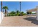 View of backyard with landscaping and a shaded patio area at 5909 E Crocus Dr, Scottsdale, AZ 85254