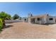 Backyard view featuring the house, landscaping, and patio at 5909 E Crocus Dr, Scottsdale, AZ 85254