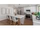 Well-equipped kitchen with stainless steel appliances, a spacious island, and elegant pendant lights at 5909 E Crocus Dr, Scottsdale, AZ 85254