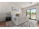 Serene main bedroom with a sliding glass door, neutral tones, and stylish decor at 5909 E Crocus Dr, Scottsdale, AZ 85254
