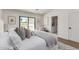 Comfortable main bedroom features plenty of natural light, a sliding glass door, and sophisticated furnishings at 5909 E Crocus Dr, Scottsdale, AZ 85254