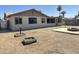 The backyard features an enclosed patio, space for entertaining, and low maintenance desert landscaping at 5924 W Tierra Buena Ln, Glendale, AZ 85306