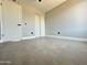 Bedroom featuring gray tile floors, closet with sliding doors and updated paint at 5924 W Tierra Buena Ln, Glendale, AZ 85306