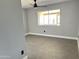 Bedroom featuring a large window with neutral walls and gray tiled floors at 5924 W Tierra Buena Ln, Glendale, AZ 85306