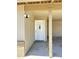 Covered entry way to front door with integrated window and side security lighting at 5924 W Tierra Buena Ln, Glendale, AZ 85306