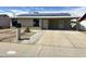 Charming single-story home with solar panels, low maintenance desert landscaping and covered parking at 5924 W Tierra Buena Ln, Glendale, AZ 85306