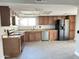 Open-concept kitchen boasting stainless steel appliances, plentiful counter space, and stylish cabinetry at 5924 W Tierra Buena Ln, Glendale, AZ 85306