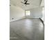 Bright and airy living room showcasing new tile flooring, fresh paint, and a modern ceiling fan at 5924 W Tierra Buena Ln, Glendale, AZ 85306