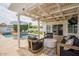 Resort-style backyard with pool, covered patio, and ample seating for outdoor entertaining at 605 W Sandra Ter, Phoenix, AZ 85023