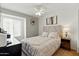 Comfortable bedroom featuring neutral colors, a ceiling fan, and a cozy bed at 605 W Sandra Ter, Phoenix, AZ 85023