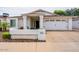 Inviting single-story home with white exterior, well-manicured yard, and a two-car garage at 605 W Sandra Ter, Phoenix, AZ 85023