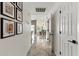 Hallway with tile floors and Gathering photos leading into the dining room at 605 W Sandra Ter, Phoenix, AZ 85023