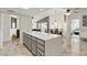 Open kitchen with a large island and eat-in dining area and spacious living room at 605 W Sandra Ter, Phoenix, AZ 85023