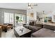 Spacious living room with modern decor, tile flooring, and sliding glass doors to the backyard at 605 W Sandra Ter, Phoenix, AZ 85023