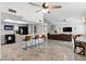 Open-concept living space with modern kitchen, bar seating, and an inviting living area at 605 W Sandra Ter, Phoenix, AZ 85023