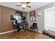 Modern office space with wood accent wall, ample monitors, sporty decor, and comfortable seating at 605 W Sandra Ter, Phoenix, AZ 85023