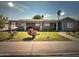 Charming single story home featuring mature landscaping, rose bushes and a covered front porch at 6111 N 64Th Dr, Glendale, AZ 85301