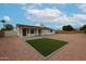 Spacious backyard with artificial grass, desert landscaping, and covered patio, perfect for outdoor entertaining at 619 N Norfolk --, Mesa, AZ 85205
