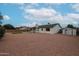 Spacious backyard featuring artificial turf, a storage shed, and gravel landscaping at 619 N Norfolk --, Mesa, AZ 85205