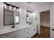 Bathroom featuring dual sinks, marble countertops, and modern fixtures at 619 N Norfolk --, Mesa, AZ 85205
