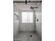 Bathroom shower featuring a modern shower system and a window at 619 N Norfolk --, Mesa, AZ 85205