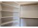 Well-organized walk-in closet with built-in shelves and hanging rods at 619 N Norfolk --, Mesa, AZ 85205