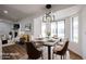 Bright dining room featuring modern chandelier and backyard views at 619 N Norfolk --, Mesa, AZ 85205