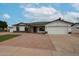 Charming single-story home featuring a two-car garage and landscaped front yard at 619 N Norfolk --, Mesa, AZ 85205