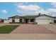 Charming single-story home with a manicured front yard, two car garage, and great curb appeal at 619 N Norfolk --, Mesa, AZ 85205