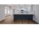 Kitchen with island and pendant lighting open to living space at 619 N Norfolk --, Mesa, AZ 85205