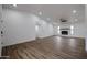 Bright open-concept living room, fireplace, and wood-look floors at 619 N Norfolk --, Mesa, AZ 85205