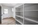 Bright pantry featuring ample shelving and convenient door access at 619 N Norfolk --, Mesa, AZ 85205