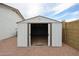 Backyard storage shed with open doors, providing ample space for tools and equipment at 619 N Norfolk --, Mesa, AZ 85205