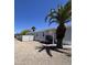 Charming single-story home with a well-maintained yard, white fence and inviting entrance at 625 W Mckellips Rd # 111, Mesa, AZ 85201