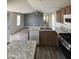 Open kitchen area with stainless appliances and island; views into the living room at 625 W Mckellips Rd # 111, Mesa, AZ 85201