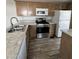 Close-up of the kitchen area with granite countertops and stainless steel oven at 625 W Mckellips Rd # 111, Mesa, AZ 85201