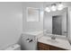 The bathroom features an undermount sink, granite counters, and a decorative mirror at 6610 E University Dr # 165, Mesa, AZ 85205