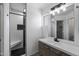 Stylish bathroom featuring modern vanity, decorative lighting and tiled stand up shower at 6610 E University Dr # 165, Mesa, AZ 85205