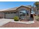 Charming single-story home featuring a tiled roof, a two-car garage, and desert landscaping at 6610 E University Dr # 165, Mesa, AZ 85205