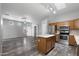 Well-designed kitchen flows into the living area with an island and stainless appliances at 6610 E University Dr # 165, Mesa, AZ 85205