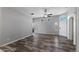 Spacious living room featuring wood-look floors, neutral walls, and lots of natural light at 6610 E University Dr # 165, Mesa, AZ 85205
