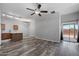 Bright living room showcases wood-look flooring and a slider to the exterior at 6610 E University Dr # 165, Mesa, AZ 85205