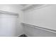 Spacious walk-in closet featuring white walls, shelf and rack hardware, providing lots of storage at 6610 E University Dr # 165, Mesa, AZ 85205