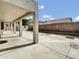 Backyard view of the house with the open patio, concrete floor, and brick wall at 6752 W Citrus Way, Glendale, AZ 85303