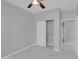 Neutral-toned bedroom featuring a ceiling fan, closet, and marble tile floors at 6752 W Citrus Way, Glendale, AZ 85303