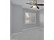 Neutral bedroom featuring a ceiling fan, window with white blinds, and marble tile floors at 6752 W Citrus Way, Glendale, AZ 85303