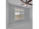 Bedroom featuring a ceiling fan, window with white blinds, and marble tile floors at 6752 W Citrus Way, Glendale, AZ 85303