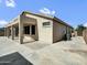 Exterior backyard view shows the covered patio and stucco exterior of the house at 6752 W Citrus Way, Glendale, AZ 85303