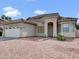 Inviting single-story home with a desert-style front yard and a spacious two-car garage at 6752 W Citrus Way, Glendale, AZ 85303
