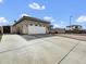 Charming single-story home showcasing a spacious driveway and well-maintained landscaping at 6752 W Citrus Way, Glendale, AZ 85303